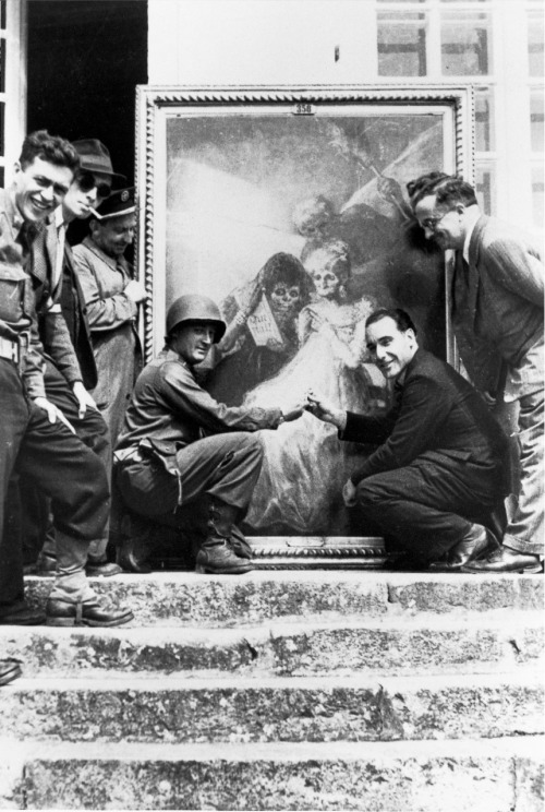 loquaciousconnoisseur: Lt. James Rorimer (kneeling, at left) and Louvre curator Germain Bazin pose i