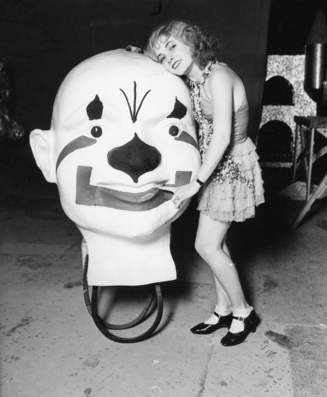  Fun with giant clown’s heads in Downtown Los Angeles, CA - 1929 