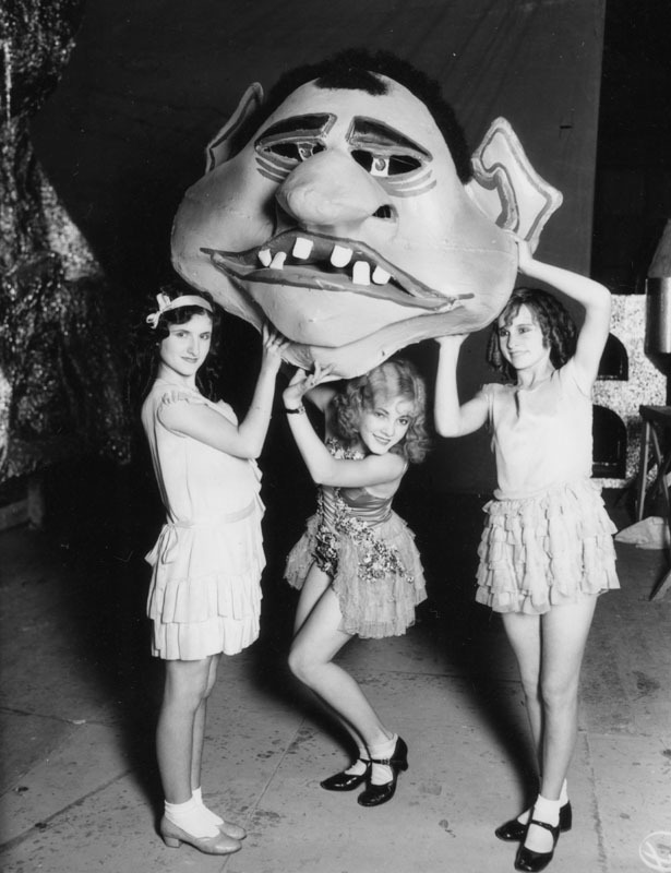  Fun with giant clown’s heads in Downtown Los Angeles, CA - 1929 