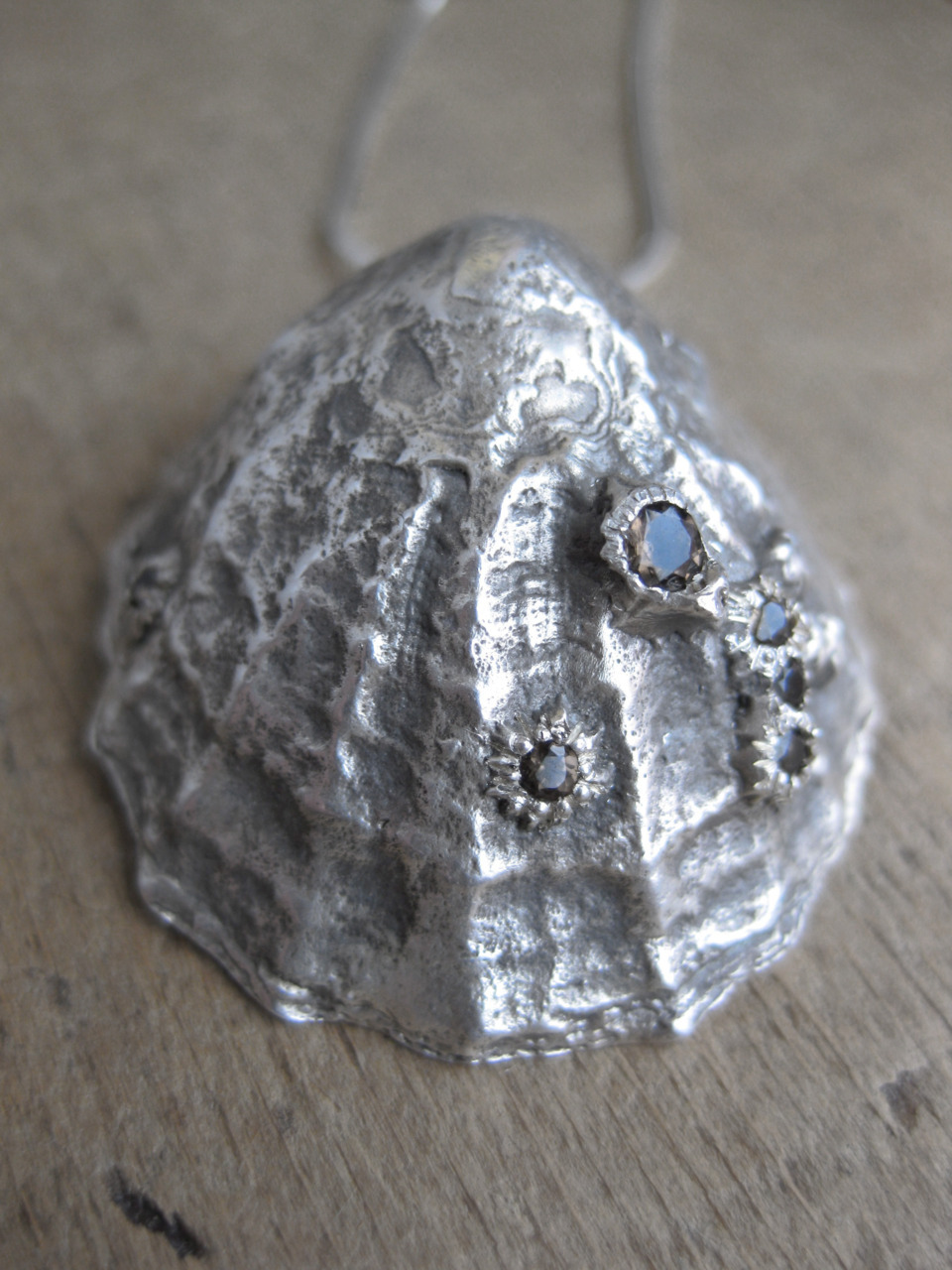 Sterling silver Limpet pendant, barnacles set with smokey quartz gems.
Limpet found on the beach at Saint Finnean’s Bay, Counry Kerry, Ireland.