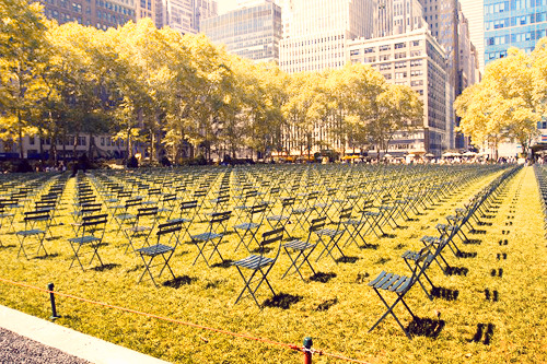 jetgirl78:  Ten Years Later: A Tribute 9/11 My favorite 9/11 tribute in New York City can be found in Bryant Park. 2,819 empty chairs are set up on the lawn facing the site where the World Trade Center once stood, one chair for every life lost. The number