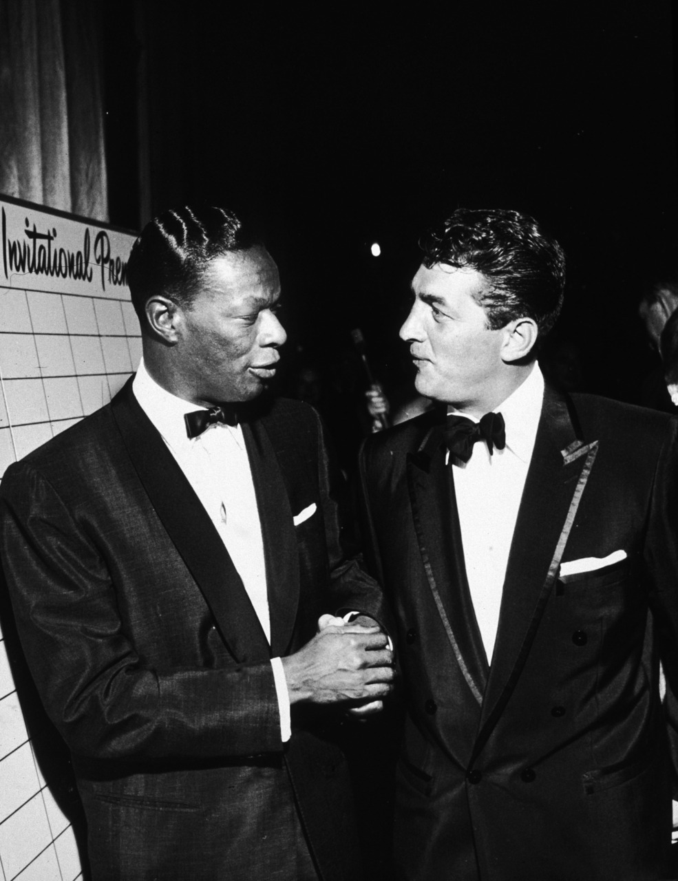 fuckyeahthekingofcool:
“ Nat King Cole chats with Dean Martin, while attending the premiere for Raintree County (1957).
”