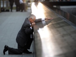 youloveesamantha:   A father pauses to remember his son at the WTC site.  :’( 