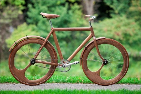 devincastro:  Designer Jan Gunneweg created this gorgeous wooden bicycle which not only has a solid wood frame, but asymmetrical wooden wheels and natural-tone brown tires. 