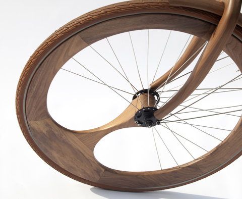 devincastro:  Designer Jan Gunneweg created this gorgeous wooden bicycle which not only has a solid wood frame, but asymmetrical wooden wheels and natural-tone brown tires. 