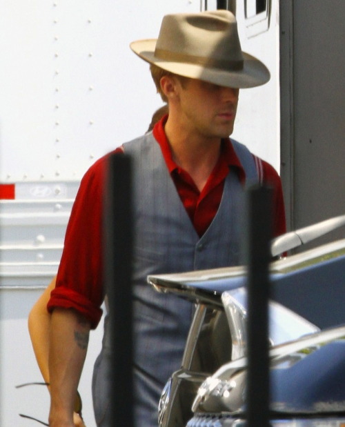 pocketsfullofpearls:  hollywoodbulletin:  Ryan Gosling kills us all with his devilishly good looks on the set of his next film, The Gangster Squad, on Tuesday, September 13. Ryan just got back from the Toronto International Film Festival and went straight