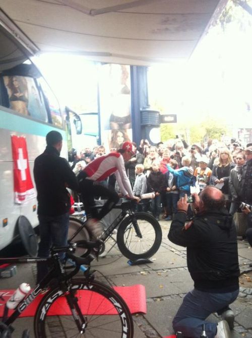 fuckyeahcycling: Elite men time trial today!  Fabian Cancellara warming up with a few onlookers