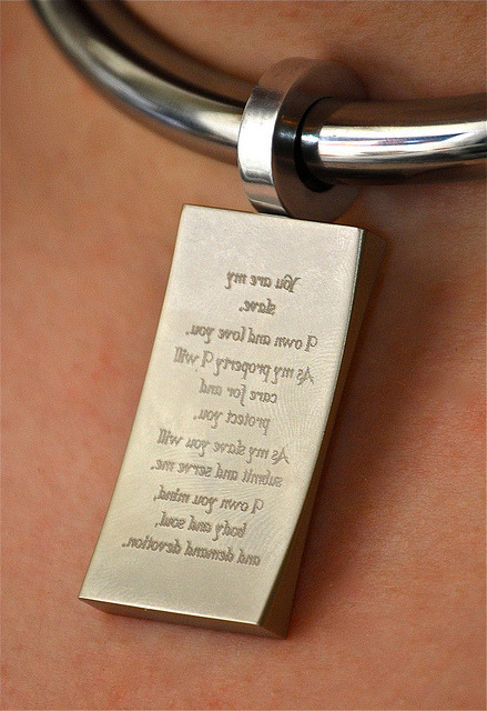  wyredslave: Message in the Mirror on Flickr. Close up of an engraved tag hung from