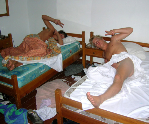 Frat boys, sharing a dorm room, sleep naked.  