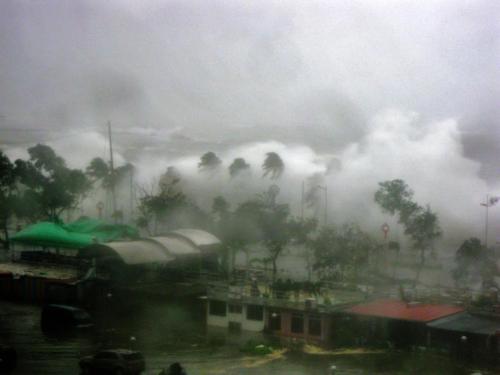 The waves crashing into the Roxas Boulevard are higher than the palm trees lining the Baywalk.