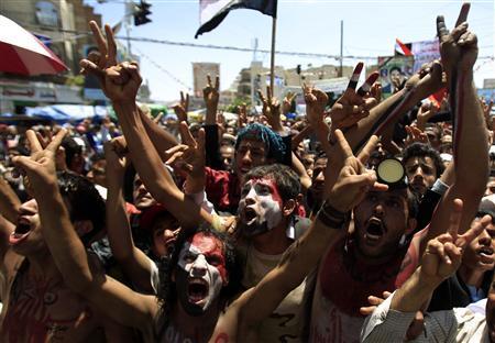 fuckyeahmarxismleninism:Anti-government protesters shout slogans during a rally to demand the ouster