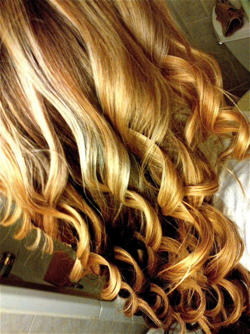 Honey blonde curly hair