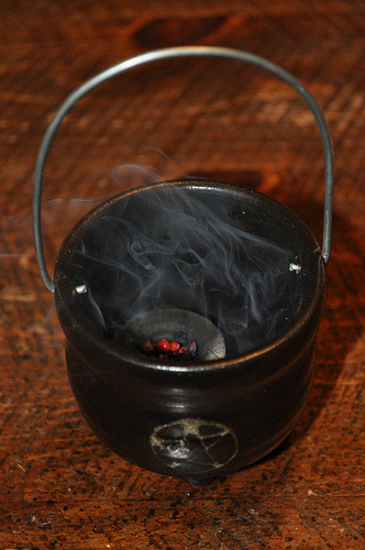 fuckyeahitchywitch:  Burning some iridescent resin incense. (by Phinley Paige) 