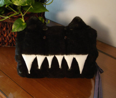 This is ADORABLE, and a terribly cute idea. Why yes, I want one. http://www.etsy.com/listing/82294326/faux-mink-monster-muff