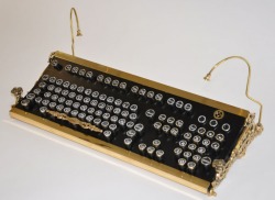  “After spending more than 250 hours on his project, [Admiral Aaron Ravensdale]‘ssteampunk keyboard is finally done. The keyboard mod was designed around a Model M. After removing the keycaps, [The Admrial] upcycled the keys from old Continental