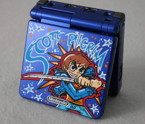 justinrampage:  Scott Pilgrim tears it up in Oskunk’s new custom Game Boy Advance SP design. You can check out more of his killer creations here. Game Boy Advance SP “Scott Pilgrim” by Oskunk (Flickr) 