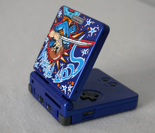 justinrampage:  Scott Pilgrim tears it up in Oskunk’s new custom Game Boy Advance SP design. You can check out more of his killer creations here. Game Boy Advance SP “Scott Pilgrim” by Oskunk (Flickr) 