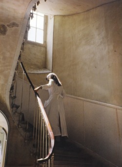 enchanting:  A staff member on the stairs at the Paris headquarters, rue Saint-Maur 