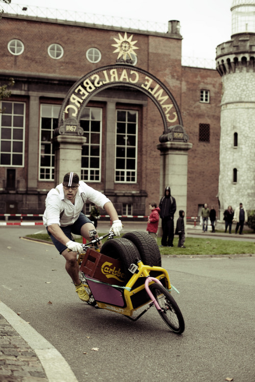 cargobikes:  This dude is intense.  Looks like he is either going to roll right over the photographe