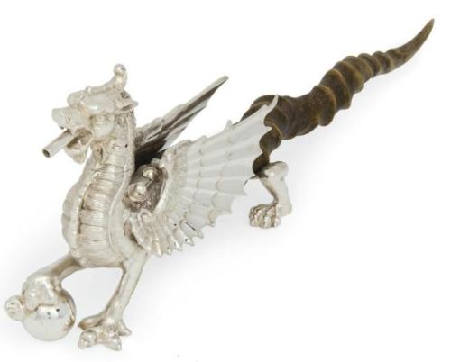 A LATE VICTORIAN ELECTROPLATED NOVELTY TABLE LIGHTER MODELLED AS THE DRAGON OF WANTLEY MARK OF WALKE