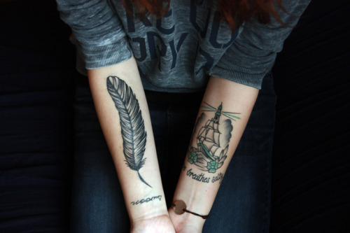 fuckyeahtattoos:  I’m a tattooed lady now, thanks to the amazing Tom Kenney of Classic Electric Tattoo & Body Piercing in Frederick, Maryland.The tattoo on the left is my fourth and most recent. It is a feather above an older tattoo of the word