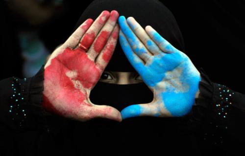 darling80m:  Women display their hands which are painted red, symbolizing bloodshed, and blue, symbolizing peace, during a demonstration demanding the ouster of Yemen’s President Ali Abdullah Saleh in Sanaa 28 September, 2011. (Photo: REUTERS - Mohamed