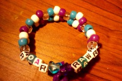 &ldquo;Roar &amp; Rawr&rdquo; Kandi I made for Nocturnal &lt;3 It has two kitties on it too, but you can&rsquo;t really see :/ 