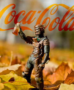 justinrampage:  Isaac Clarke drinks in the sweet taste of Coca-Cola while enjoying the Autumn weather. Humorous Fall / Dead Space themed photo taken by Ви Лог. Coca Cola by Ви Лог (Blog) (Twitter) Submitted by: Ви Лог 