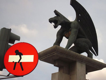 austinkleon:  Florence-born street artist Clet Abraham sticks removable stickers onto street signs across Italy. I love the idea of non-destructive graffiti, and would love a way to do my de-signs in real life without getting arrested… (via murketing)
