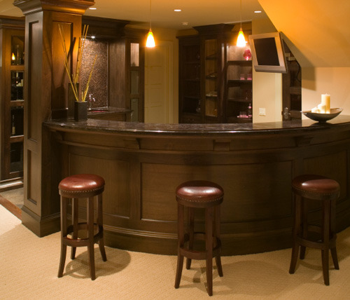 Curved Home Wet Bar Tucks Into Basement Stairwell...