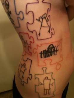 fuckyeahtattoos:  I got this tattoo after my first year of working with kids with autism. I love them with all my heart, and each 5-year-old child drew a photo of themselves as a robot. The puzzle pieces are a spin on the Autism Awareness Ribbon. They