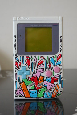 tinycartridge:  Custom-painted Game Boy featuring Tetris blocks by French artist Oskunk (click for larger images). Buy: Tetris: Axis (October 2) Find: Nintendo DS/3DS release dates, discounts, &amp; more See also: More Tetris posts [Via Oskunk] 