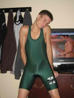 syracusesaggerboy:  Love him, the porn in the background and all of the pre-cum and cum stains on his singlet…ah those where the days of high school, god how I miss them!!!! I’d play with him any and everyday!!! 