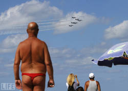 life:  Oh, hello. We don’t call it the Week’s Best Photos for nothin’ right? Pictured: On a beach in Tel Aviv, people watch the Breitling Jet Team perform aerobatics over the Mediterranean Sea. 