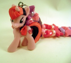 rarasjewels:  http://www.etsy.com/listing/83938834/my-little-pony-necklace-lucky-swirl