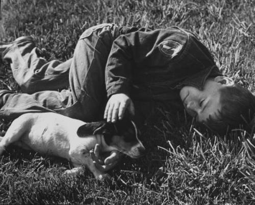 legrandcirque:A boy playing with his dog. Photograph by Ed Clark. USA, May 1955.