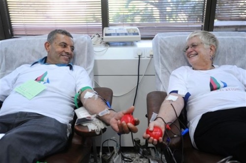 shalom-salaam: Palestinian Wajee Tameise and Israeli Mashka Litvak donate blood together as part of 