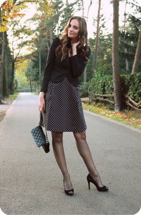 Polienne very chic in black polka dot skirt, heels and sheer tights