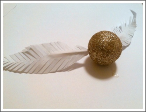 DIY Golden Snitch. Easy to create ornament using styrofoam balls, glitter, glue, toothpics, and