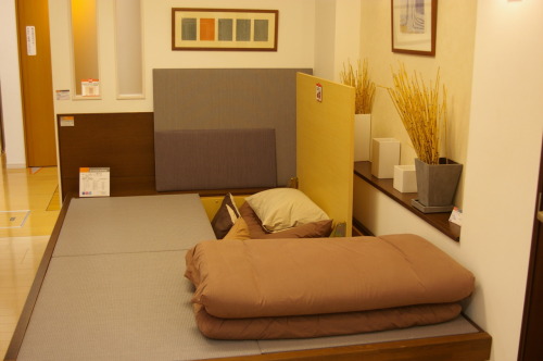 Sample living space with storage space hidden under tatami mats. Taken in the Panasonic Center in Sh