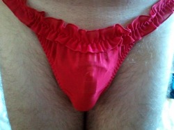 boy2spank:  Me in a cute, red thong. There’s a bow in the back (may post that tomorrow). You can make out the outline of my chastity device underneath. That thong barely covers the essentials… Cute, or not? 