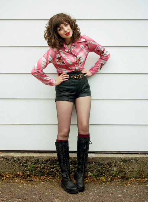 Striped pink shirt, black leather shorts and pantyhose