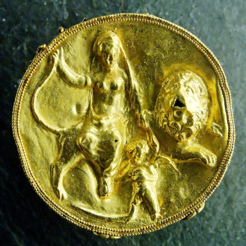 dwellerinthelibrary:“Medallion with Aphrodite sitting on a lion and Eros. Greek artwork, 3rd c
