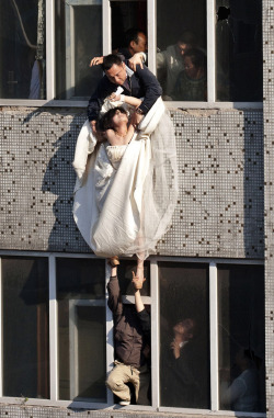 mbozki:   The bride surnamed Li cut her wrists and tried to commit suicide after her boyfriend broke up with her just before the marriage.    Look at her face. She’s given up completely.  This is the most beautiful picture I’ve seen, honest  My favorite