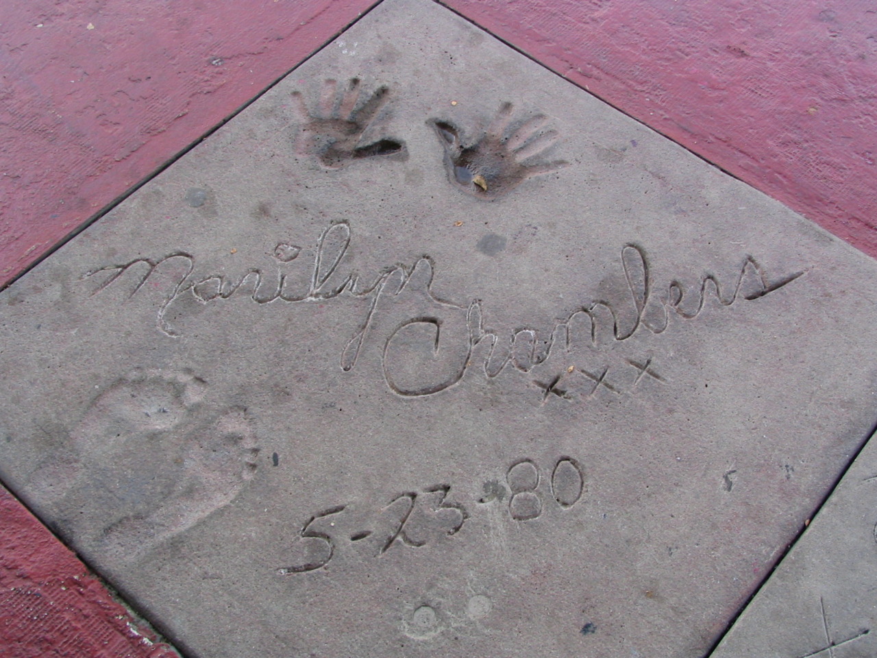 May 23, 1980: At the premier of Insatiable, placing hand and foot prints in cement