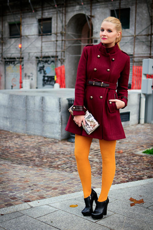 Flashy yellow tights and uptight dark red coat