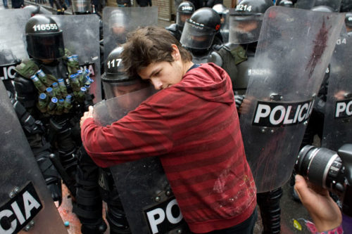 t92marihoene:  kat-cardenas:  riskybizness:  nunubunkie:  hunk-wonder:  knifeshock:  poisonforthemasses:  monsieurpaprika:  kreedkafer:  loracora:  galosengen:  barrymanilowswinternightmare:   A demonstrator embraces a riot police officer during a student