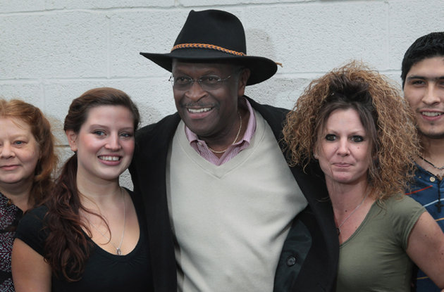 Herman Cain woos the 80s hair band vote campaigns in Michigan (Scott Olson/Getty Images)