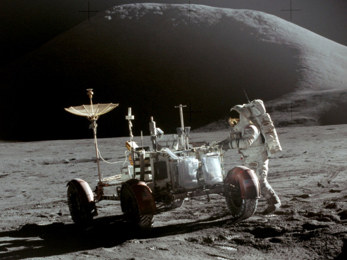 Apollo 15: James Irwin with the Lunar Roving Vehicle, near Mount Hadley, on the Moon, 31 July 1971.