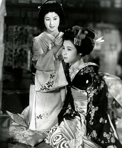 ica-zakura:  Gion Bayashi (1953) Michiyo Kogure as Geiko Miyoharu in the background and Ayako Wakao 